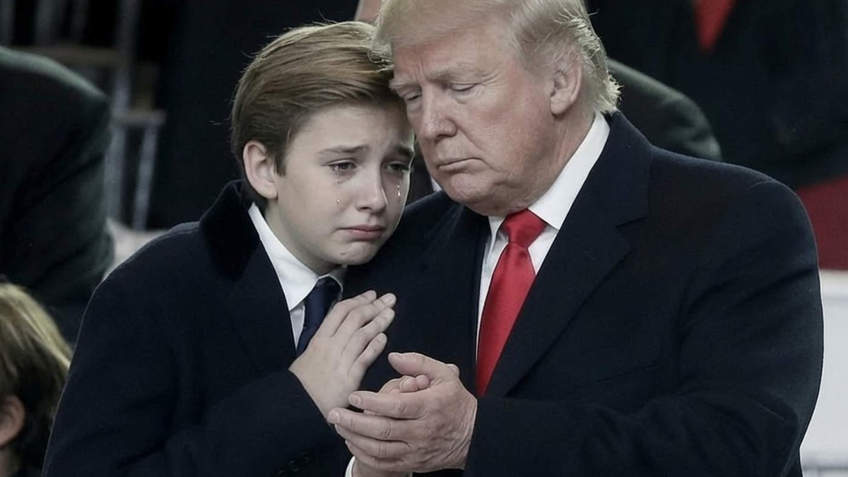 Barron Trump in formal black suit standing with an adult in dark suit and red tie