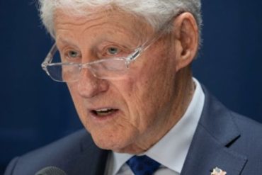 Bill Clinton viral headline fact-check speaking at podium with glasses
