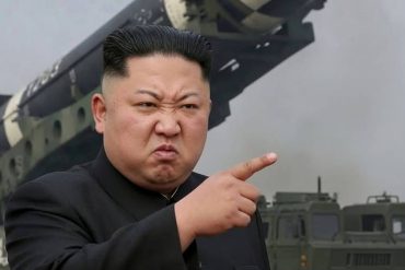 Clickbait military propaganda image with person pointing at missile launcher