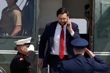 Official in suit conducting diplomatic negotiations and international discussions while exiting government aircraft