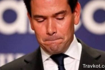 Marco Rubio confirmation hearing at podium with serious expression during Senate testimony