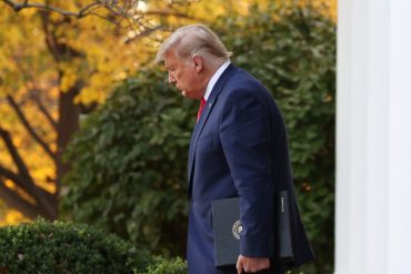 President Donald Trump walks out after announcing he has signed an order to ban DEI practices in federal contracts