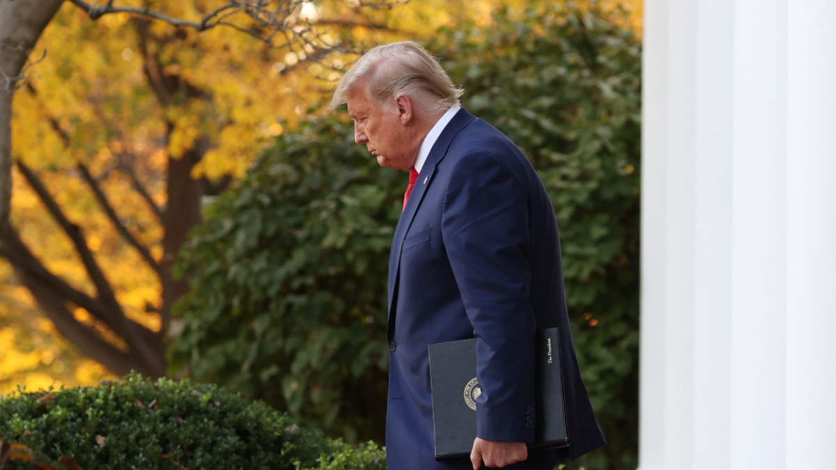President Donald Trump walks out after announcing he has signed an order to ban DEI practices in federal contracts