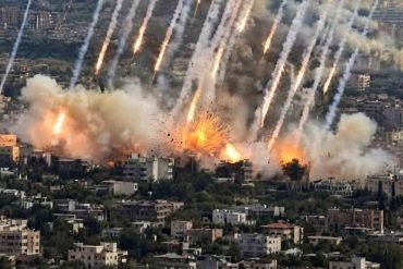 Dramatic rocket attack Los Angeles aerial view showing multiple missiles striking urban area with explosions