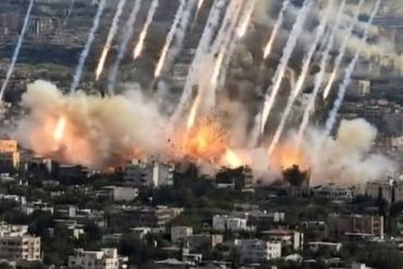 Aerial view of rocket attack Los Angeles showing multiple missiles striking urban area with explosions and smoke