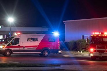 Emergency responders at scene of Stockton mass shooting birthday party incident with ambulance and fire truck