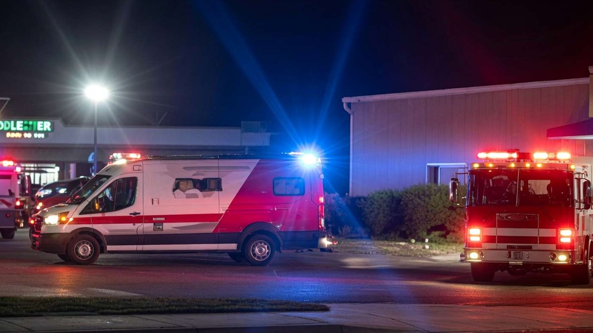 Emergency responders at scene of Stockton mass shooting birthday party incident with ambulance and fire truck