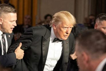 Security personnel escort man during Trump shooting incident Washington at formal event