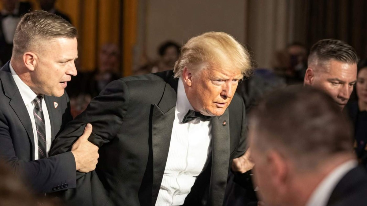 Security personnel escort man during Trump shooting incident Washington at formal event
