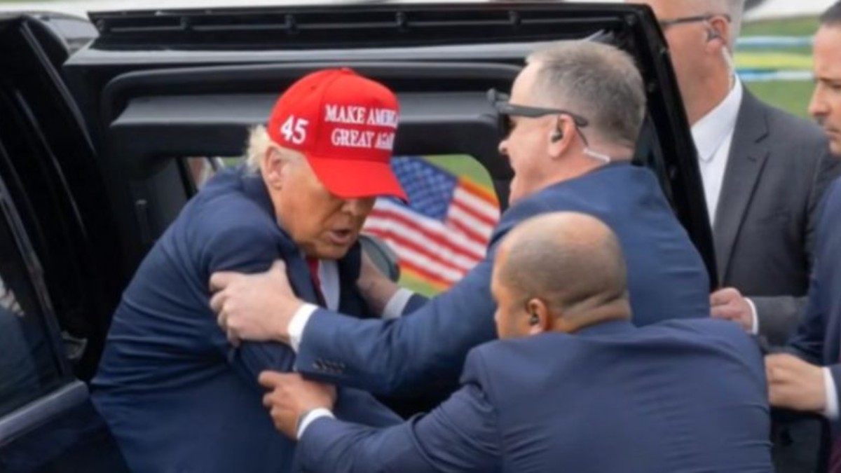 Security personnel assist during incident related to Trump shot misinformation claims and assassination attempt