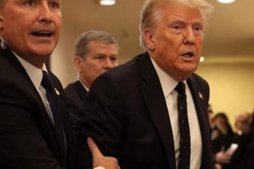 Trump shooting White House Correspondents dinner event with security personnel in formal attire