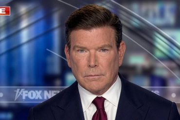 Professional news anchor ( broadcaster ) during live Fox News television broadcast