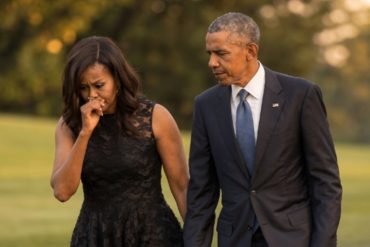 Marian Robinson walks with family member on White House grounds in formal attire