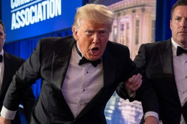 Man in tuxedo with security detail at White House shooting security breach event